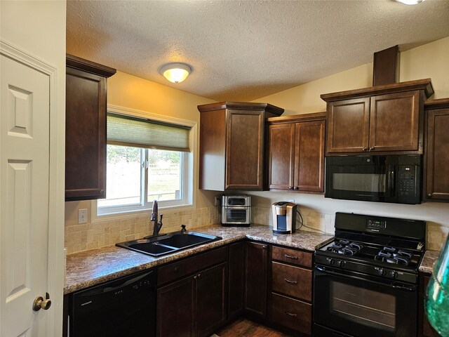 kitchen with decorative backsplash, dark brown cabinets, black appliances, and a sink