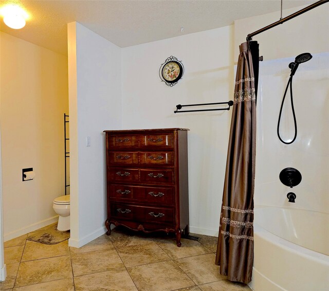 full bathroom featuring tile patterned flooring, toilet, baseboards, and shower / tub combo with curtain