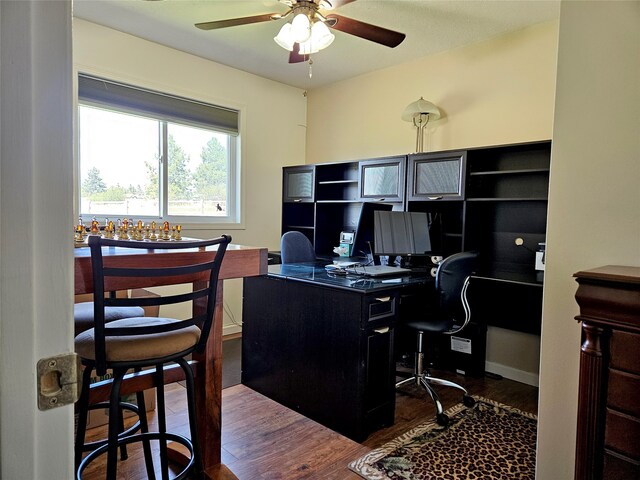 home office featuring ceiling fan and wood finished floors