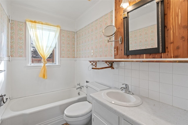 bathroom with a bathing tub, vanity, and toilet