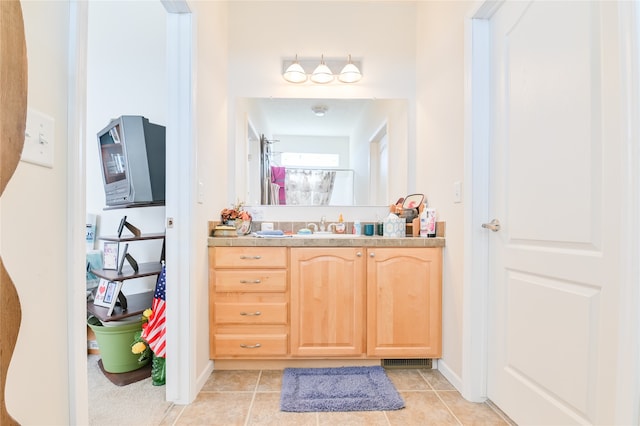 bathroom featuring tile patterned floors and vanity