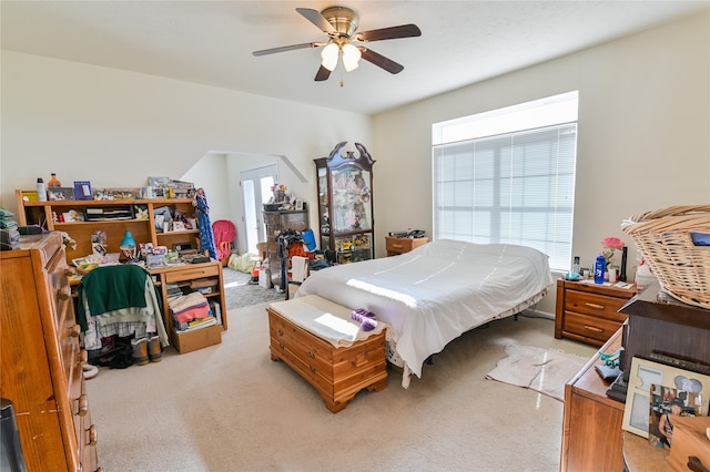 bedroom with ceiling fan and light colored carpet