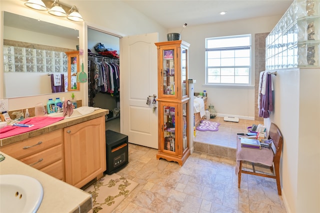 bathroom with tile patterned floors and vanity