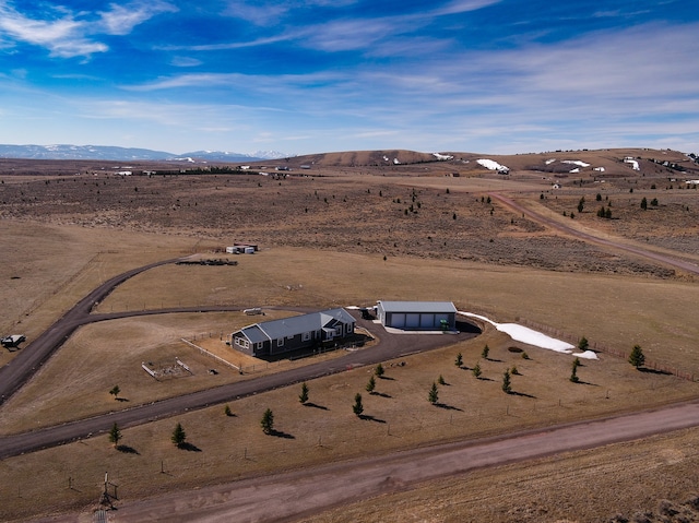 birds eye view of property featuring a rural view and a mountain view