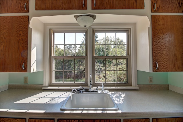 kitchen featuring a wealth of natural light and sink