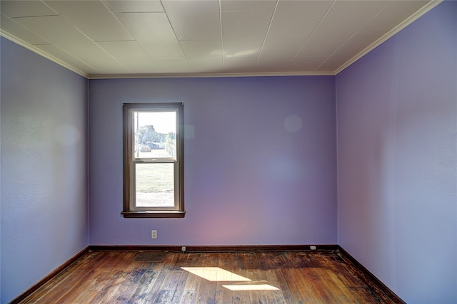 unfurnished room with ornamental molding, dark hardwood / wood-style flooring, and a healthy amount of sunlight