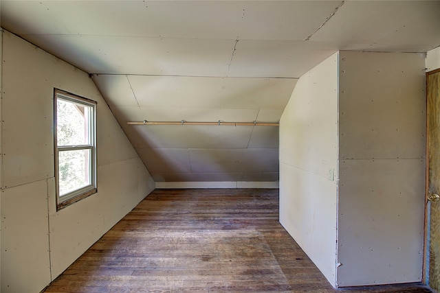 bonus room featuring vaulted ceiling and hardwood / wood-style flooring