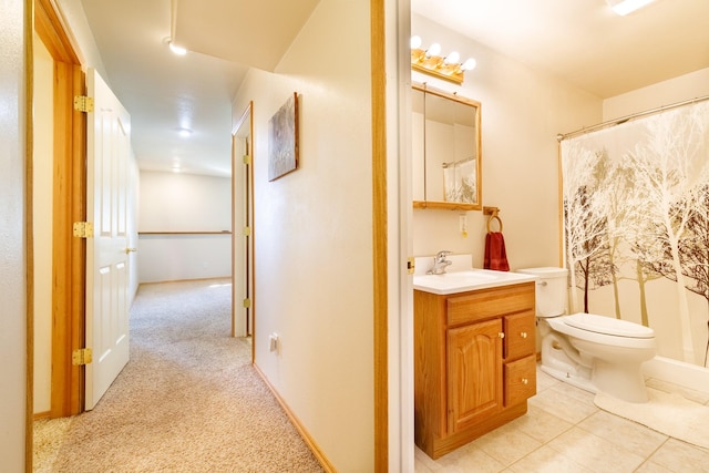 bathroom with vanity, a shower with shower curtain, toilet, and tile patterned flooring