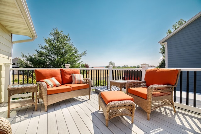 wooden terrace featuring an outdoor living space