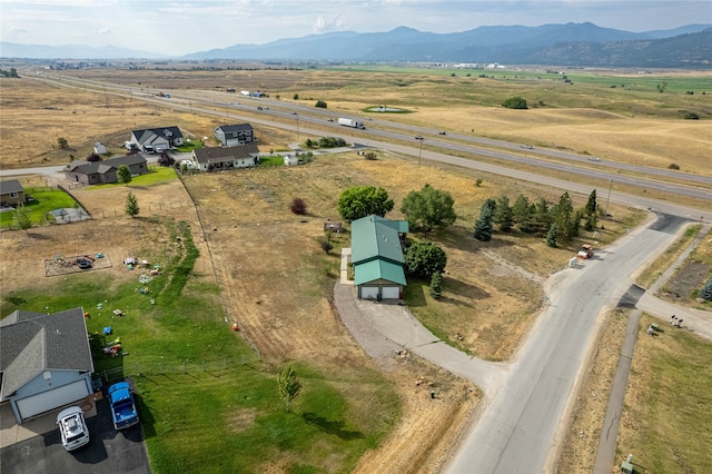 bird's eye view featuring a mountain view and a rural view