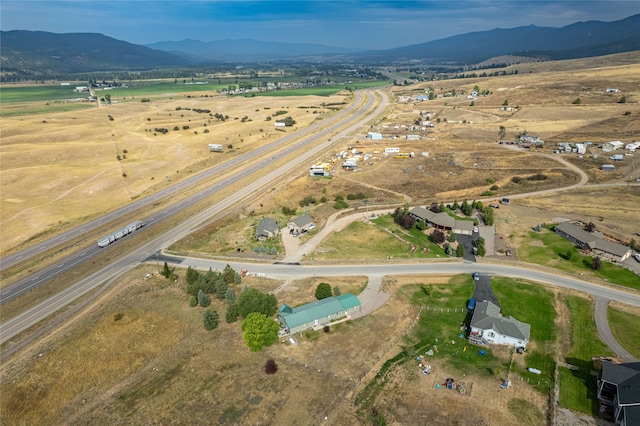 aerial view with a mountain view and a rural view