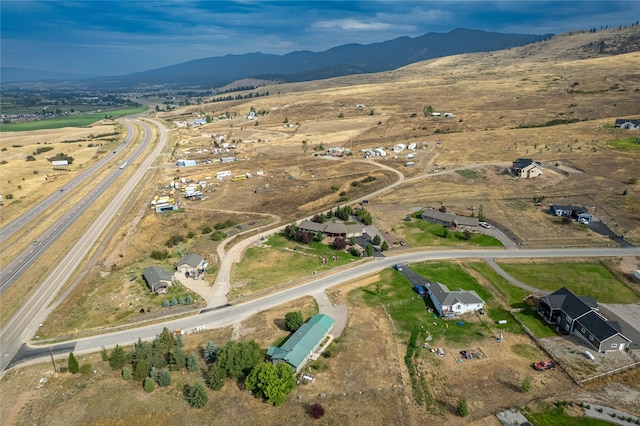 birds eye view of property featuring a mountain view