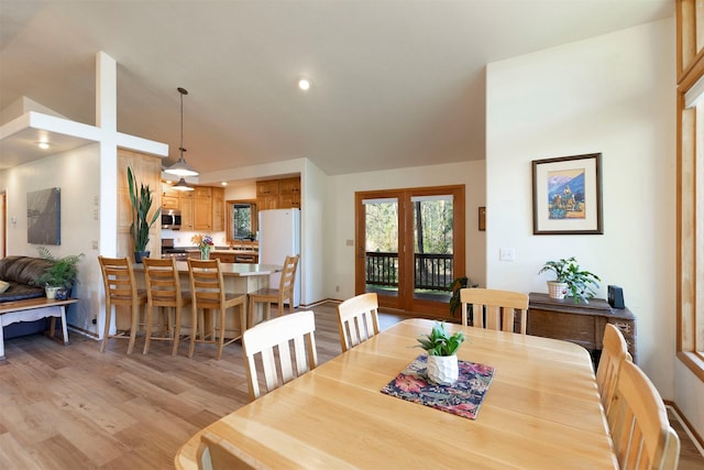 dining room featuring recessed lighting and light wood finished floors