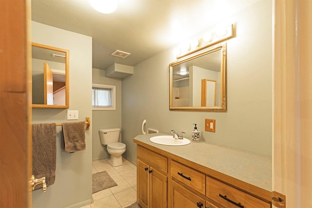 bathroom featuring toilet, tile patterned flooring, visible vents, and vanity