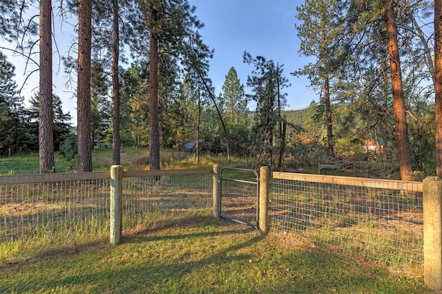 view of gate with fence