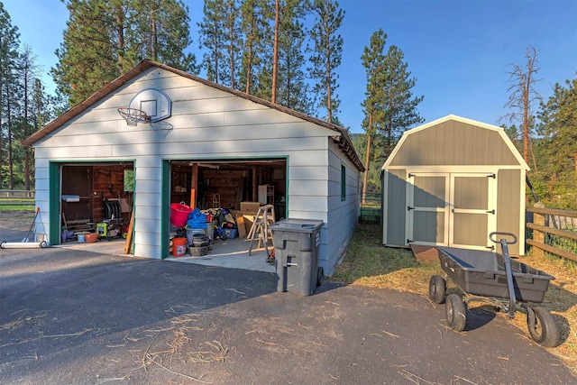 detached garage with a storage shed