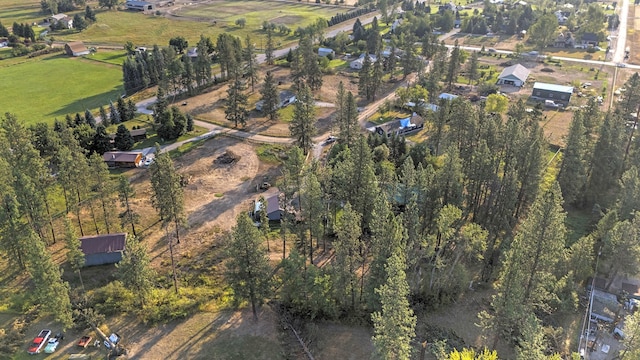 birds eye view of property with a rural view