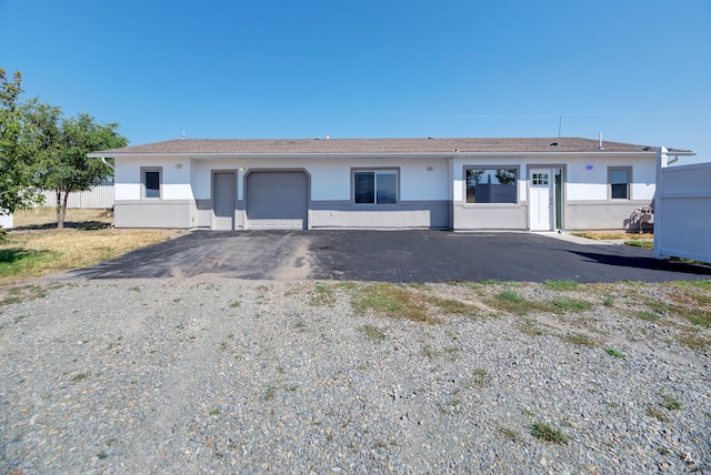 ranch-style home with a garage