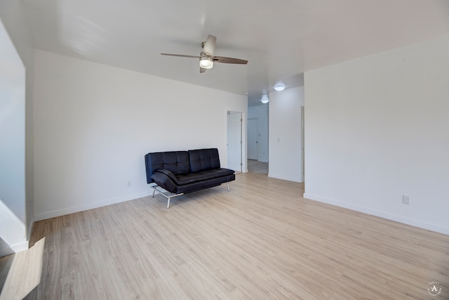 living area with ceiling fan and light wood-type flooring