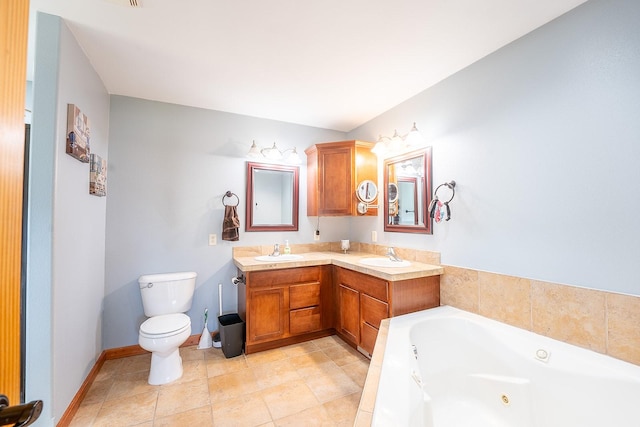 bathroom featuring toilet, vanity, a bathtub, and tile patterned floors