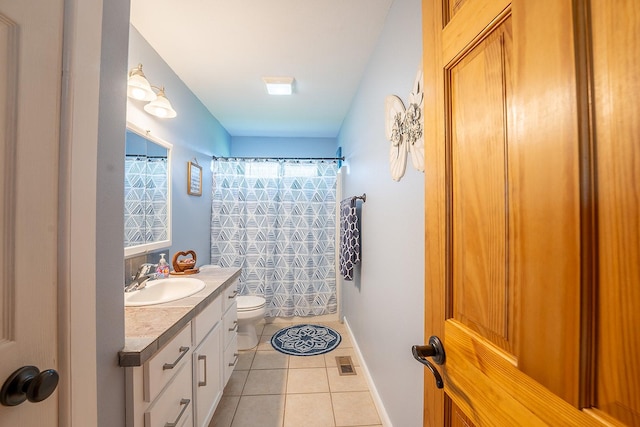 bathroom featuring a shower with shower curtain, tile patterned floors, toilet, and vanity