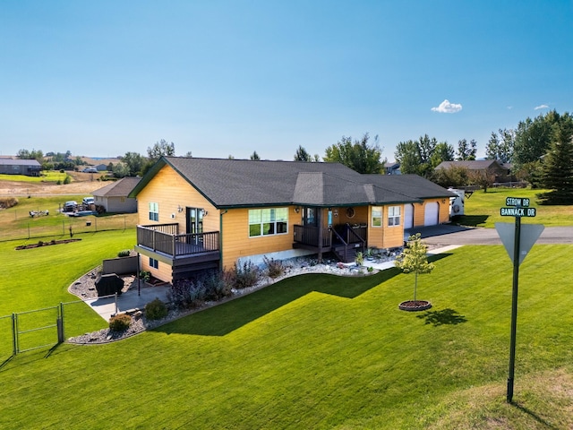 view of front of property with a front lawn and a garage