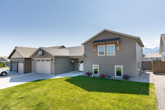 view of front of property with a garage and a front yard