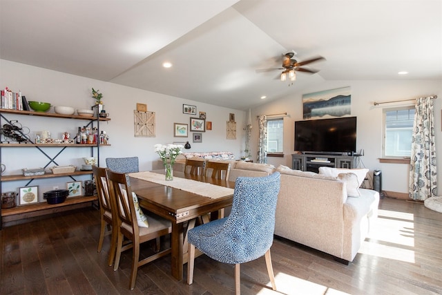 dining area with ceiling fan, hardwood / wood-style floors, a healthy amount of sunlight, and lofted ceiling