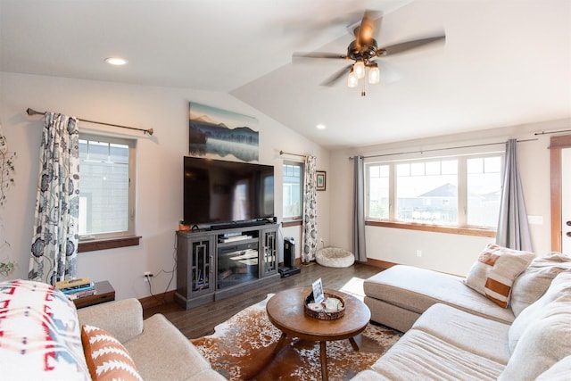 living room featuring ceiling fan, a fireplace, hardwood / wood-style flooring, and lofted ceiling