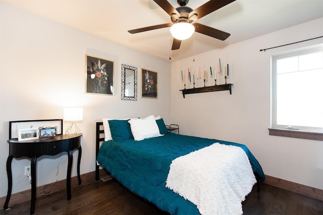 bedroom featuring ceiling fan and dark hardwood / wood-style flooring