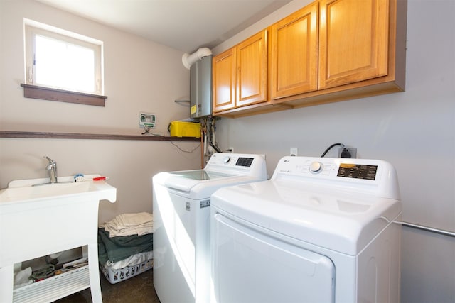 laundry area featuring carpet flooring, washer and clothes dryer, and cabinets