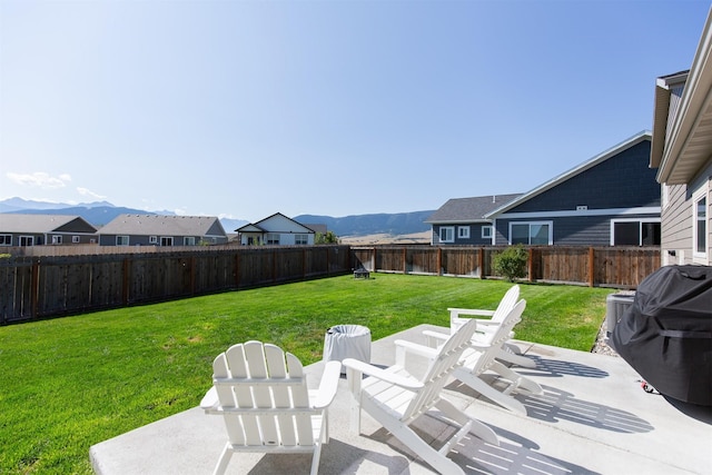 exterior space with a mountain view and a grill