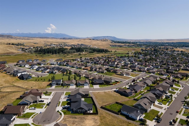 birds eye view of property with a mountain view