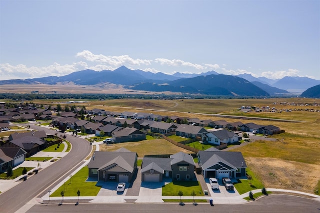 birds eye view of property featuring a mountain view