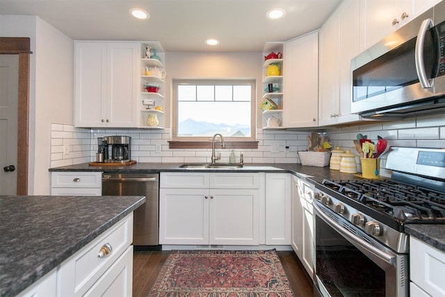 kitchen featuring appliances with stainless steel finishes, tasteful backsplash, and dark hardwood / wood-style flooring