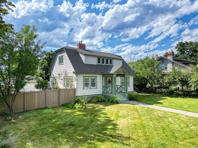 view of front of home with a front lawn