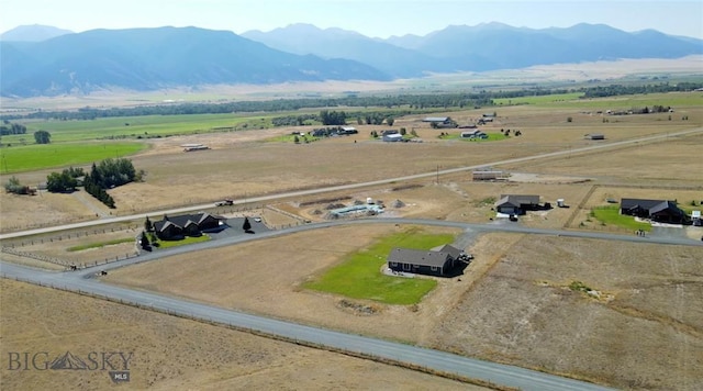 aerial view with a mountain view and a rural view