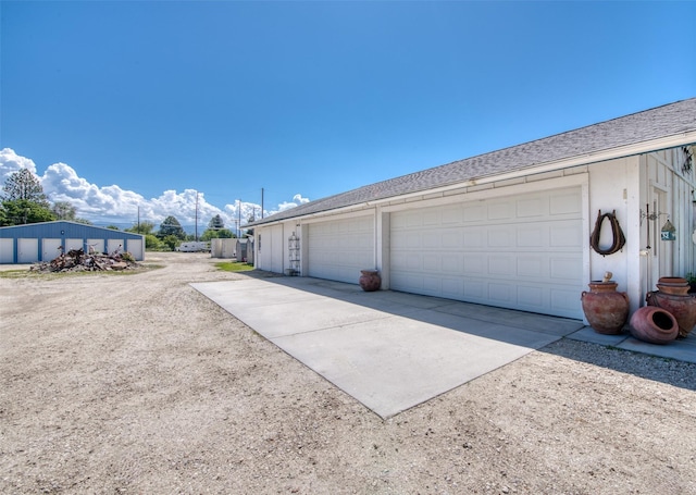 garage featuring driveway