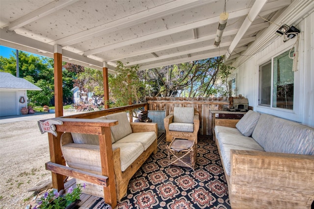 wooden terrace featuring an outdoor hangout area