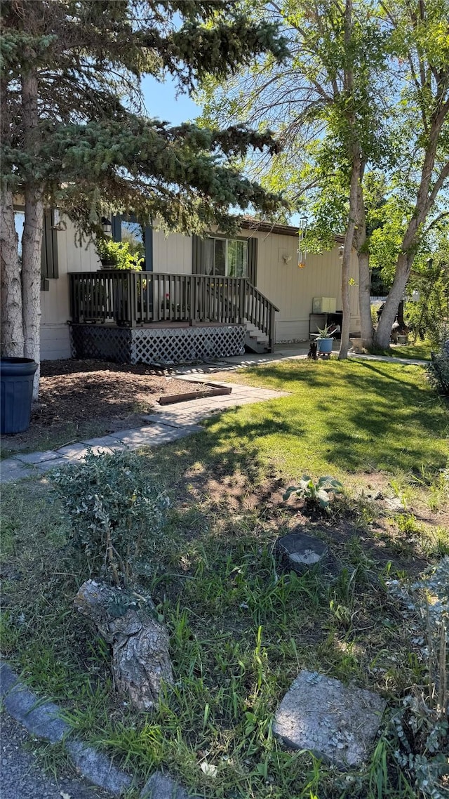 view of yard with a wooden deck