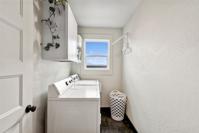 laundry area with tile patterned flooring, separate washer and dryer, and cabinets