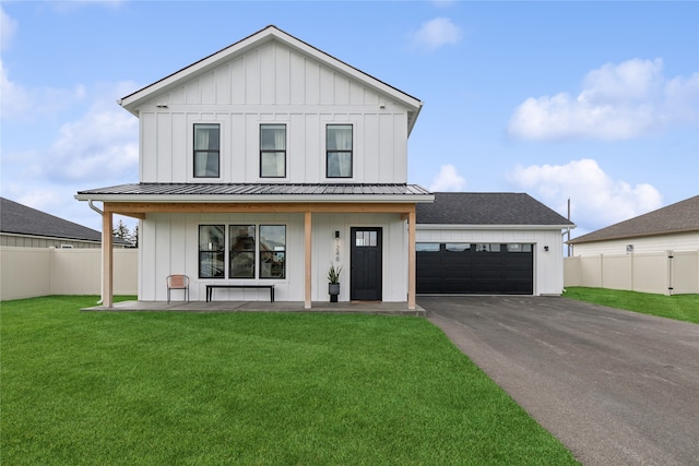 view of front of house with a garage and a front yard