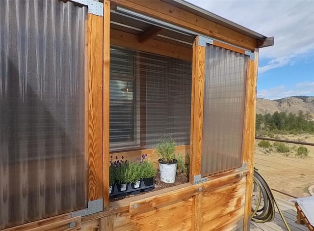 view of outbuilding featuring a mountain view and an outdoor structure