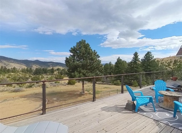 5355 Peaks View Dr, Helena, MT 59602 - wooden deck featuring a fire pit and a mountain view