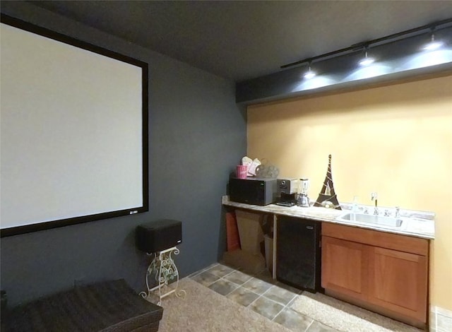 5355 Peaks View Dr, Helena, MT 59602 - bar featuring track lighting, black microwave, a sink, and light tile patterned flooring