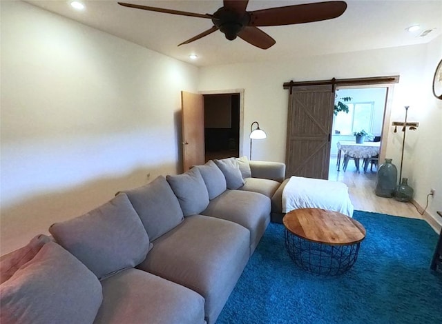 5355 Peaks View Dr, Helena, MT 59602 - living room featuring ceiling fan, a barn door, recessed lighting, and wood finished floors