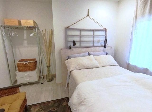 bedroom featuring wood finished floors