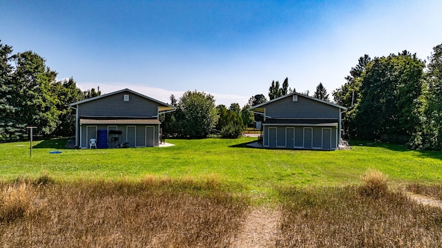 view of yard with an outbuilding and a garage