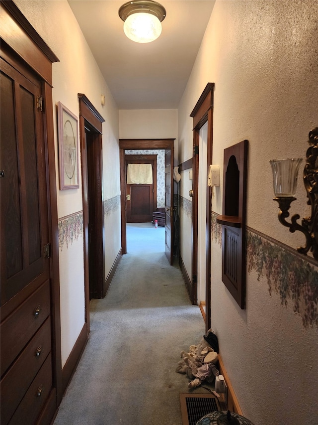 hallway with light carpet