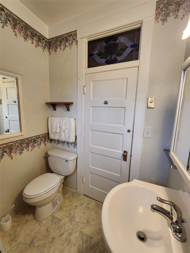 bathroom with toilet and sink